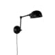 De wandlamp van Zuiver geeft een leuk effect met de buigbare arm. 