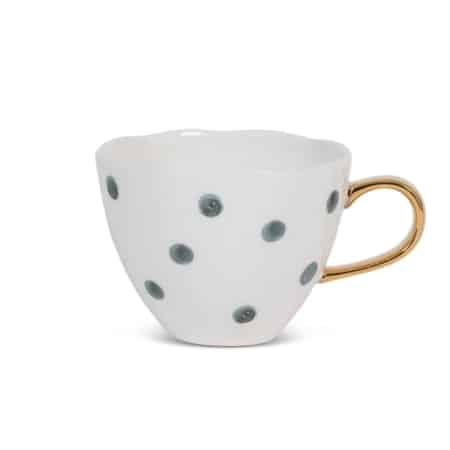 Start je dag heerlijk ontspannen met de Good Morning Cup van Urban Nature Culture. Hoe vroeg je ochtend ook is, elke Good Morning Cup brengt een glimlach op je gezicht. De mok is gemaakt van porselein en heeft een mooie organische vorm met een handgeschilderd gouden oortje.