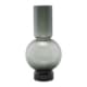 Spring in op de huidige trends en gebruik gekleurd glas in je huis. Met Bubble van House Doctor haal je een decoratieve vaas in huis die een leuk en elegant tintje geeft. De vaas is gemaakt van glas en heeft een mooie, transparante uitstraling met grijsachtige glans wat de vaas een eenvoudige, evenwichtige aantrekkingskracht geeft. De organische vorm van de vaas voegt ook een prachtige, natuurlijke elegantie toe aan het huis en is daarom het perfecte detail op de eettafel of op de vensterbank. Zet een boeket verse bloemen in de vaas of een paar takjes uit de tuin om een gezellige sfeer in je huis te creëren.